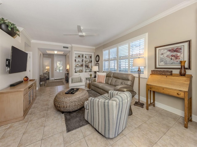 tiled living room featuring built in shelves, ceiling fan, and ornamental molding