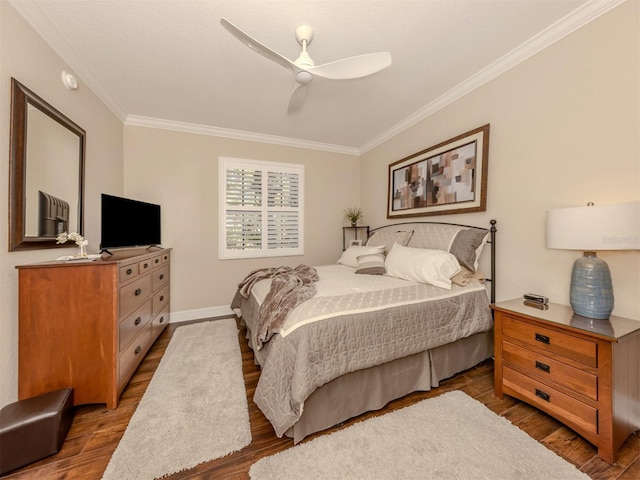 bedroom featuring ceiling fan, wood-type flooring, and ornamental molding