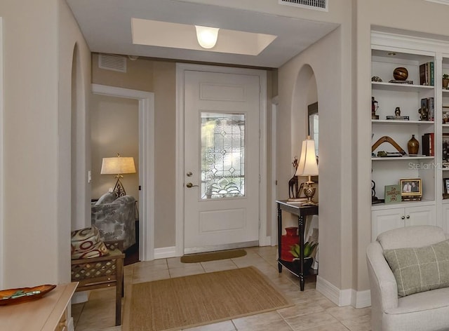 entryway with light tile patterned floors