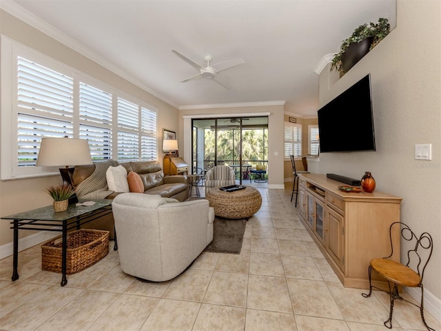 tiled living room with ceiling fan and crown molding