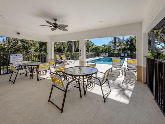 view of patio / terrace featuring ceiling fan and a community pool