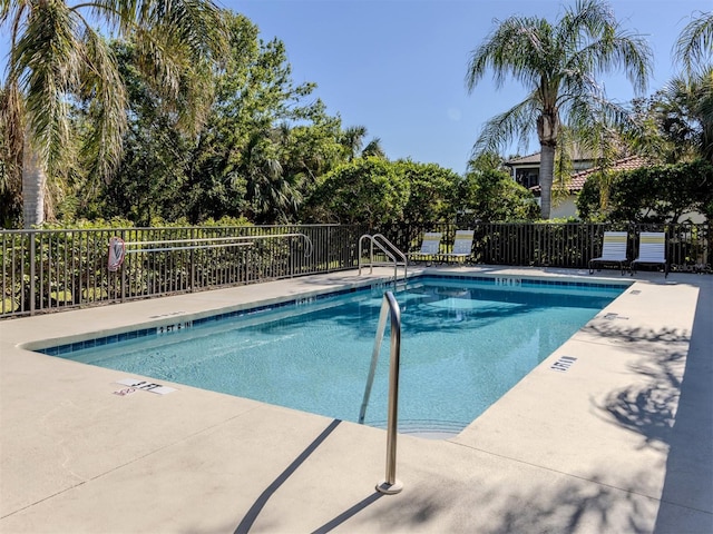 view of swimming pool featuring a patio area