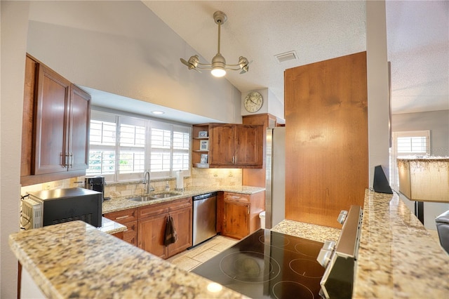 kitchen with backsplash, a wealth of natural light, sink, and appliances with stainless steel finishes