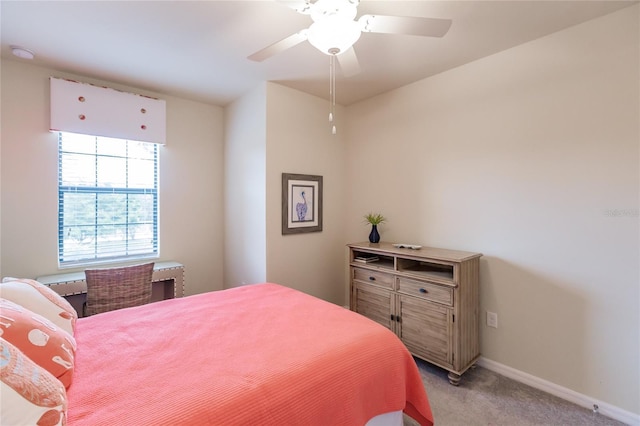 bedroom featuring light colored carpet and ceiling fan