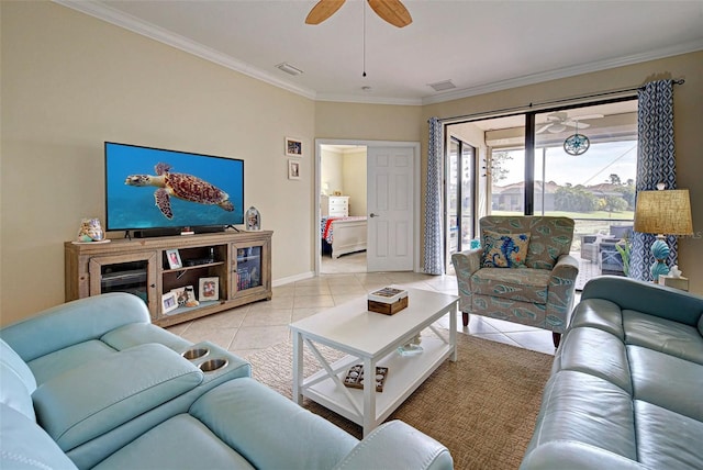 living room with ceiling fan, ornamental molding, and light tile patterned flooring