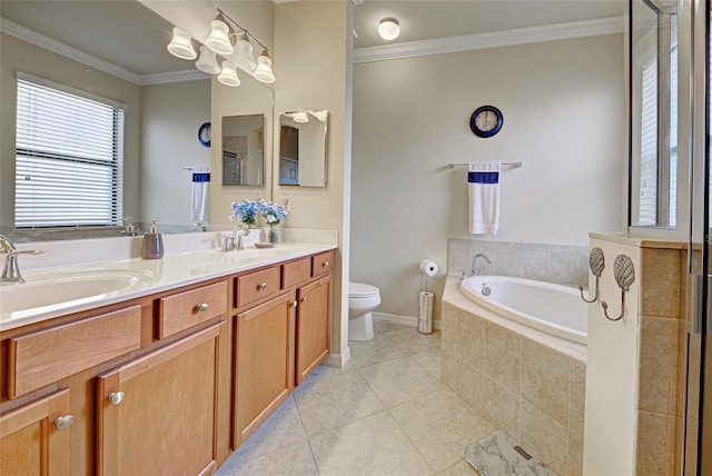 bathroom featuring tile patterned floors, vanity, crown molding, tiled tub, and toilet