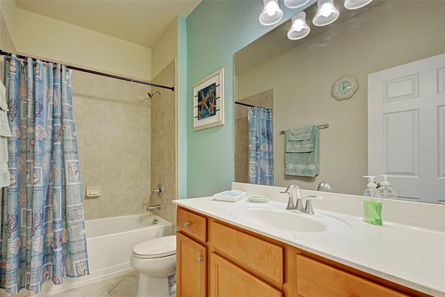 full bathroom featuring tile patterned floors, shower / tub combo with curtain, vanity, and toilet