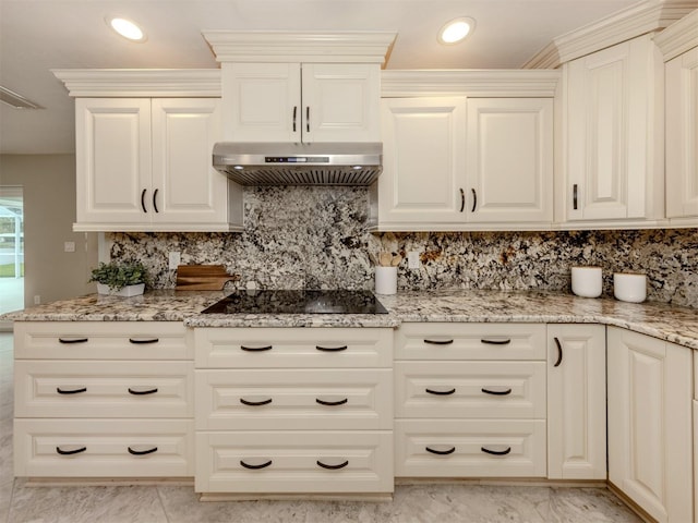 kitchen with light stone countertops, black electric stovetop, tasteful backsplash, and exhaust hood