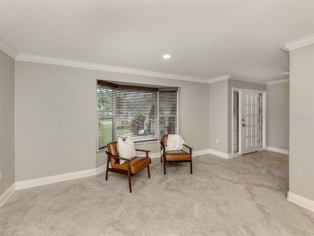 sitting room featuring crown molding