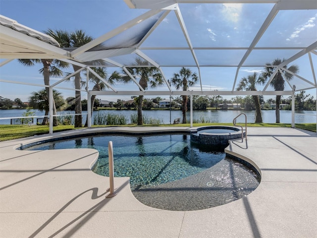 view of swimming pool featuring an in ground hot tub, a water view, glass enclosure, and a patio area