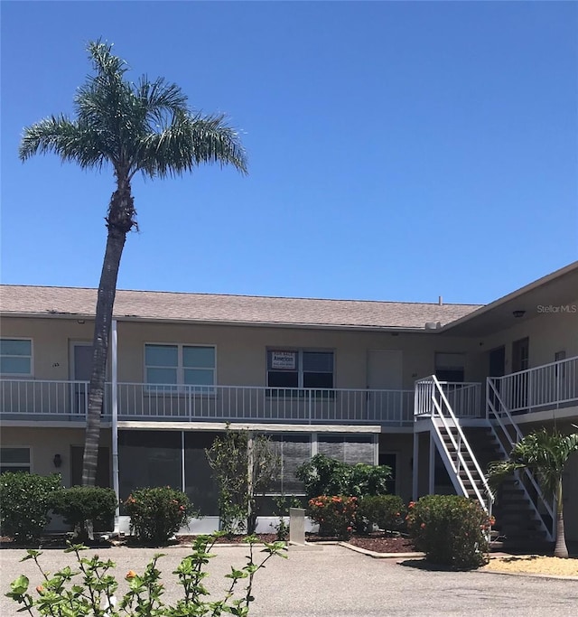 300 Base Ave E Unit 123, Venice, FL 34285 - view of building exterior featuring stairway