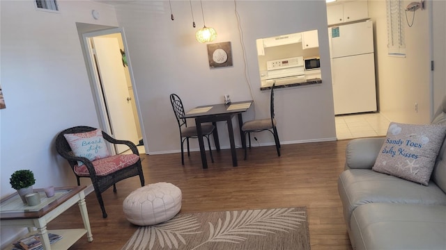 300 Base Ave E Unit 123, Venice, FL 34285 - living room featuring wood finished floors and baseboards