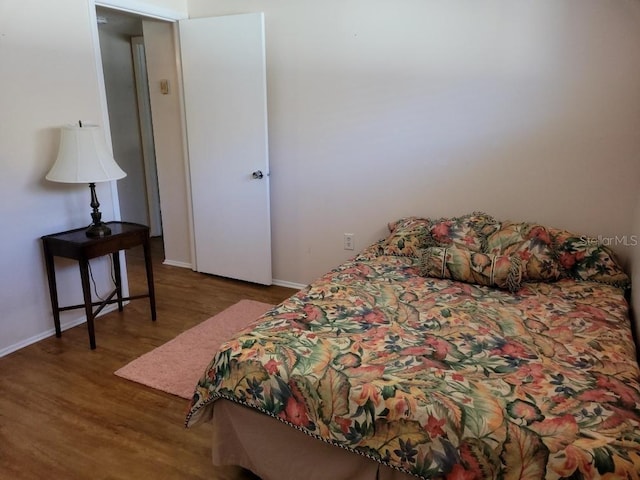 300 Base Ave E Unit 123, Venice, FL 34285 - bedroom with wood finished floors and baseboards