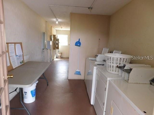 300 Base Ave E Unit 123, Venice, FL 34285 - shared laundry with washer and clothes dryer and attic access