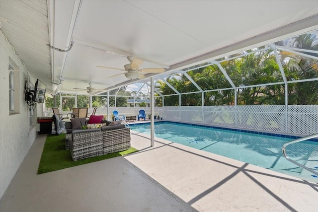 view of pool featuring a lanai, an outdoor hangout area, and a patio