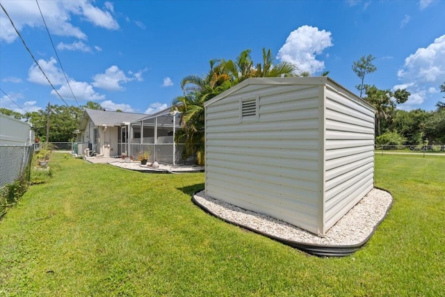 view of outbuilding with a lawn