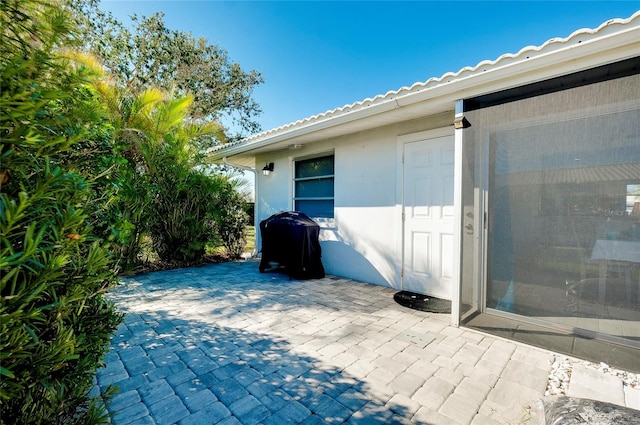 view of patio featuring a grill