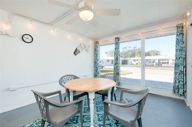 dining room featuring ceiling fan and a wealth of natural light