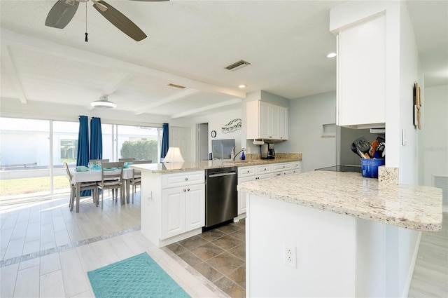 kitchen with stainless steel dishwasher, white cabinetry, kitchen peninsula, and beam ceiling