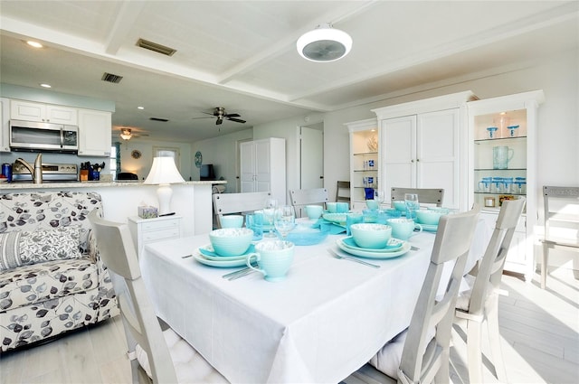 dining area featuring light hardwood / wood-style flooring and ceiling fan