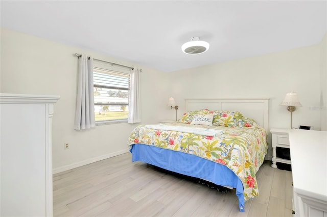 bedroom with light hardwood / wood-style floors