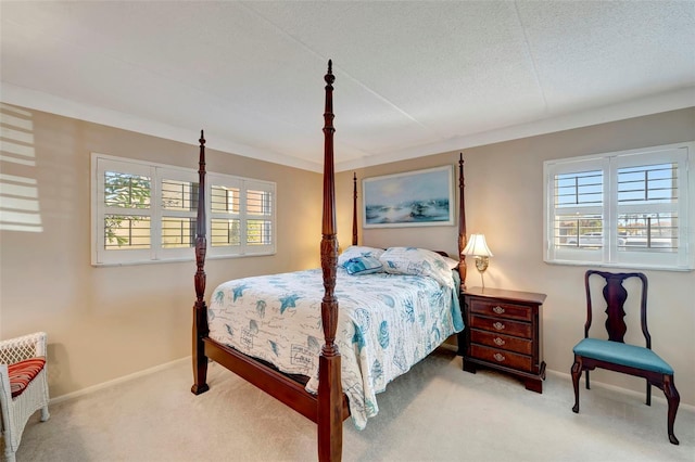 carpeted bedroom with radiator heating unit and a textured ceiling