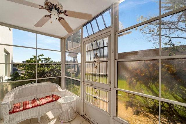 sunroom / solarium featuring ceiling fan