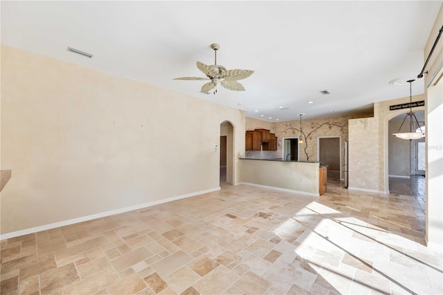 unfurnished living room featuring ceiling fan