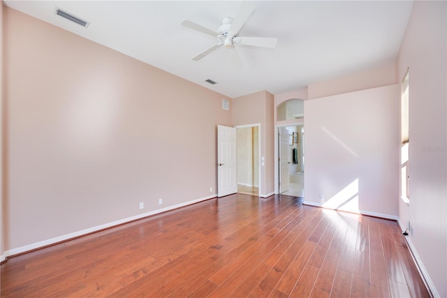 empty room featuring ceiling fan and hardwood / wood-style floors