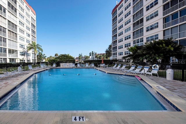 view of swimming pool featuring a patio area