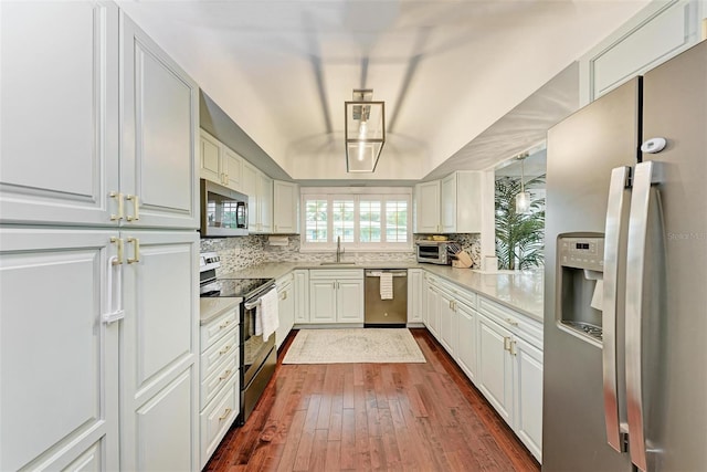 kitchen featuring sink, white cabinets, dark hardwood / wood-style flooring, and stainless steel appliances