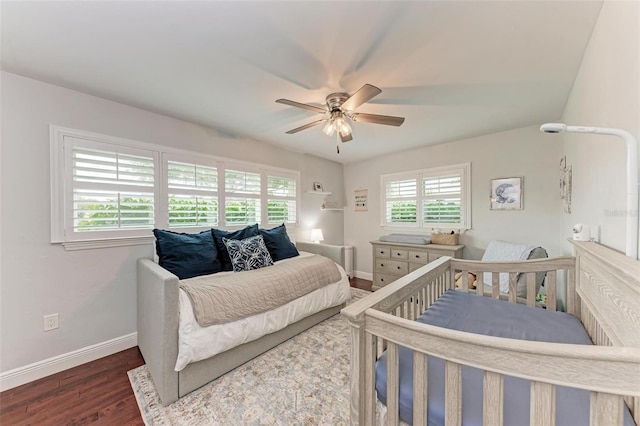 bedroom featuring ceiling fan and dark hardwood / wood-style flooring