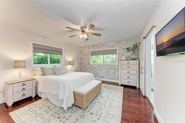 bedroom featuring ceiling fan and dark wood-type flooring