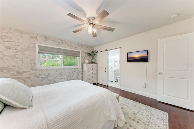 bedroom with ceiling fan, ensuite bath, and dark hardwood / wood-style flooring