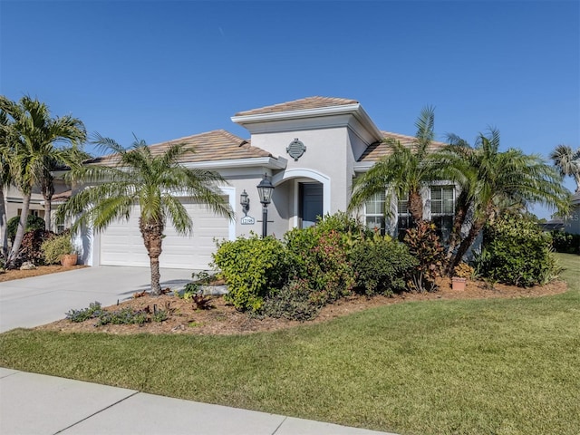 view of front of house with a front lawn and a garage