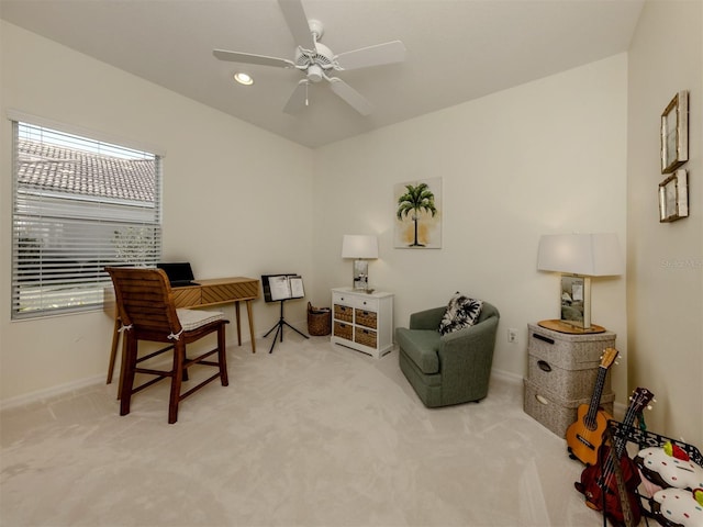 carpeted office featuring ceiling fan