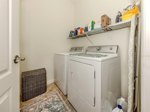 clothes washing area with washing machine and clothes dryer