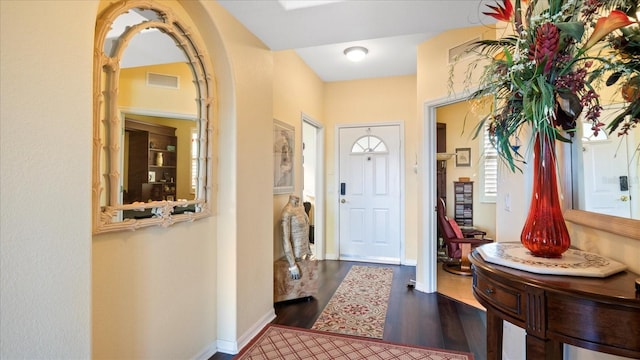 entrance foyer featuring dark hardwood / wood-style floors