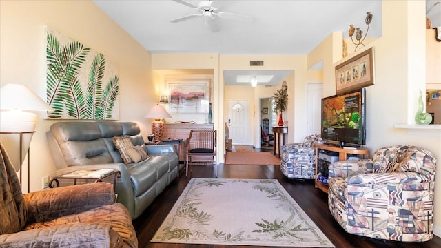 living room featuring dark hardwood / wood-style flooring and ceiling fan