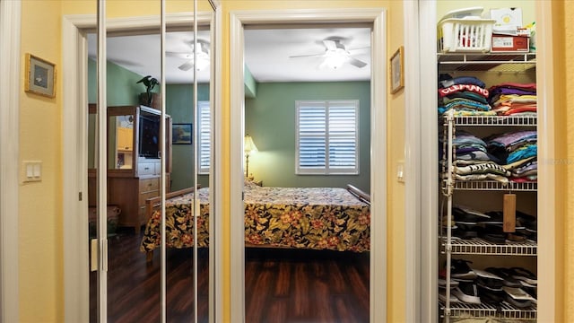 bedroom with hardwood / wood-style flooring and ceiling fan