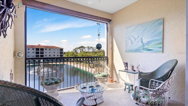 balcony featuring a water view