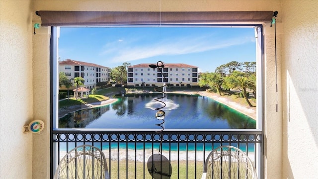 view of swimming pool featuring a water view