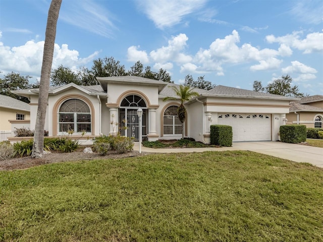 view of front facade with a front lawn and a garage