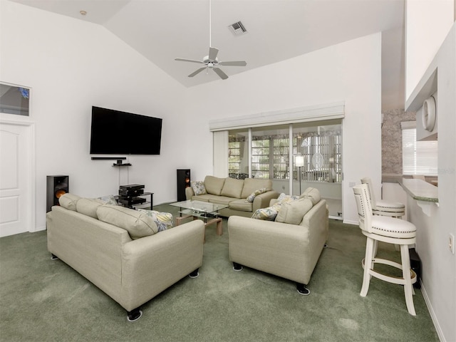 carpeted living room with vaulted ceiling, a wealth of natural light, and ceiling fan