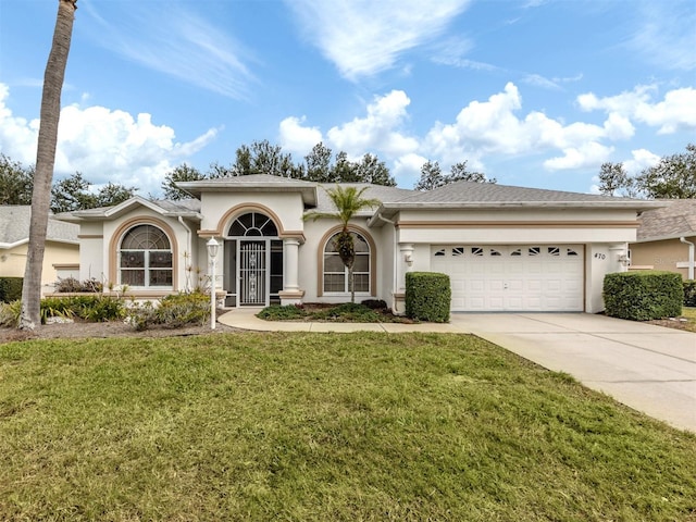 view of front facade featuring a garage and a front yard