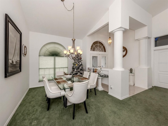 dining room featuring french doors, an inviting chandelier, vaulted ceiling, decorative columns, and carpet