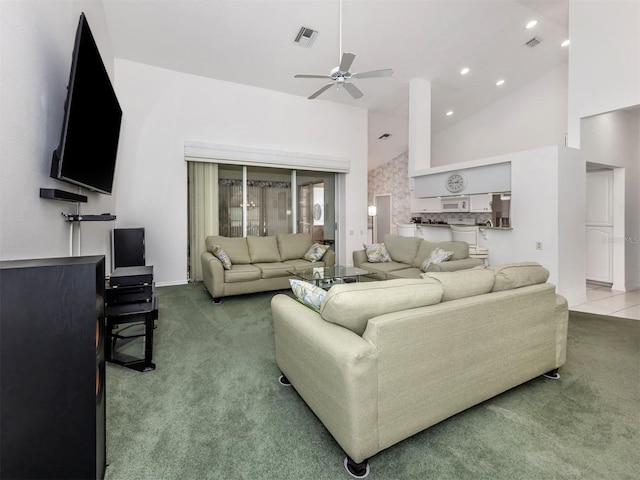 carpeted living room featuring ceiling fan and high vaulted ceiling