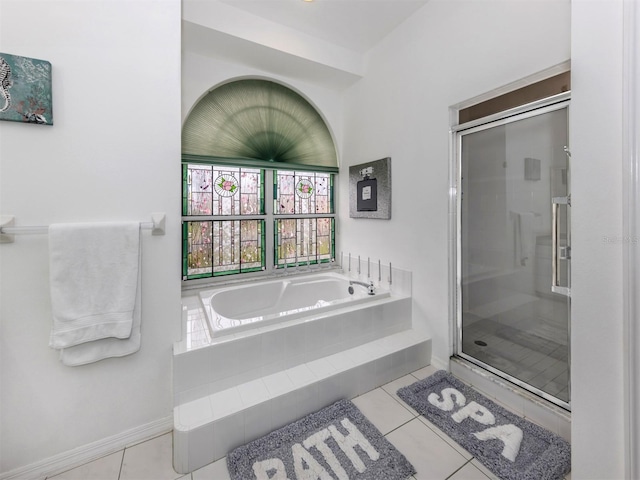 bathroom with tile patterned floors and plus walk in shower