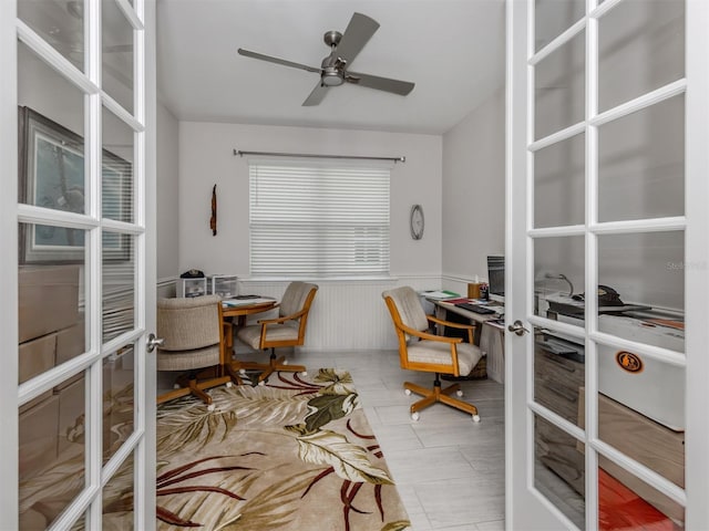 office with ceiling fan and french doors