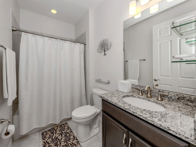 bathroom featuring toilet, vanity, and tile patterned floors